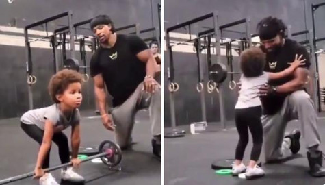 Padre anima a su hija en el gimnasio
