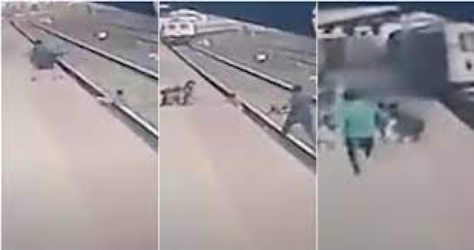 Hombre salva a un niño justo antes de ser arrollado por un tren