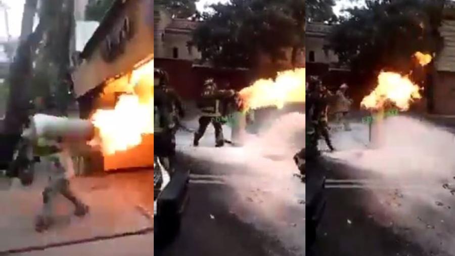 ¡Como de película! Bombero carga tanque de gas en llamas para evitar que explote en restaurante 
